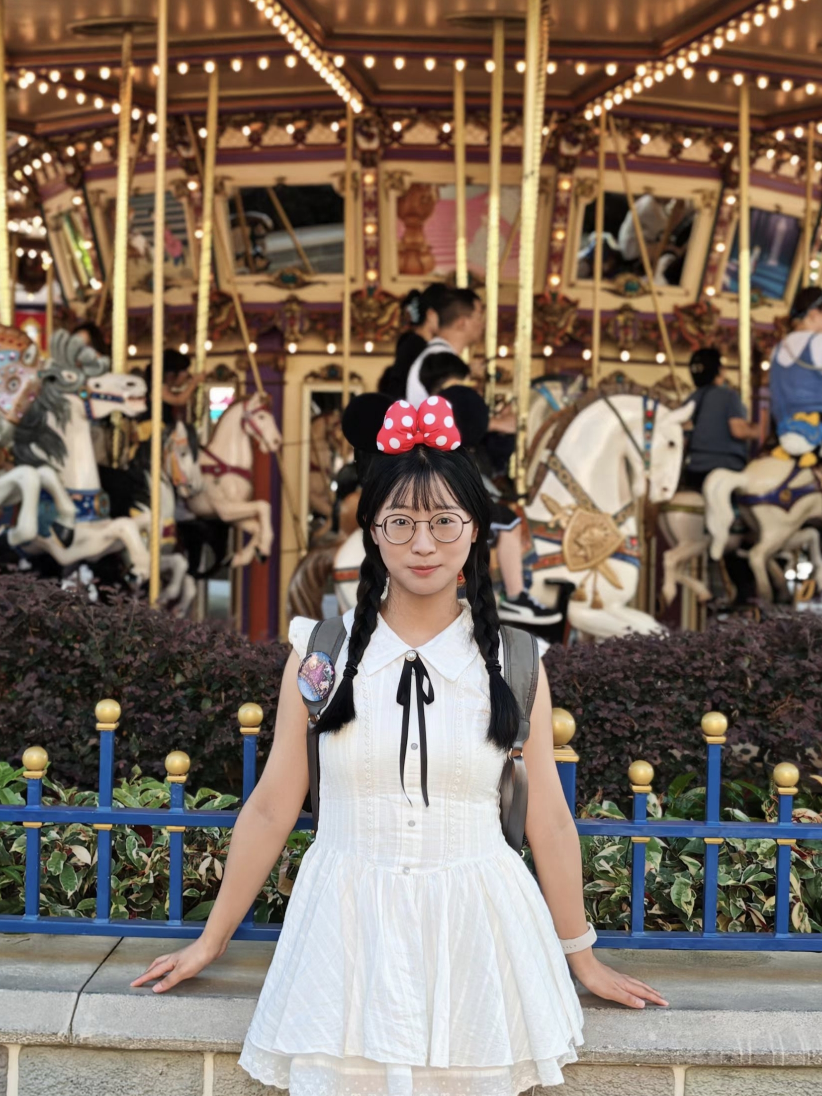 Jiawei Chu by a carousel